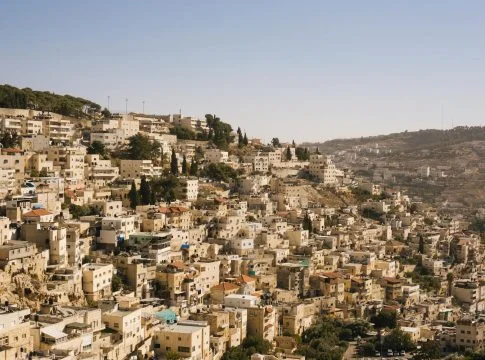 beige concrete buildings on high ground