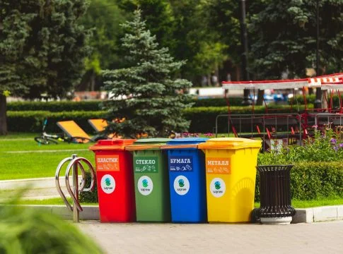 assorted color plastic trash bins